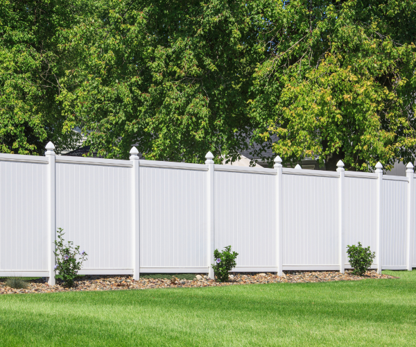 White fence in a beautiful yard-professional landscaping services utah