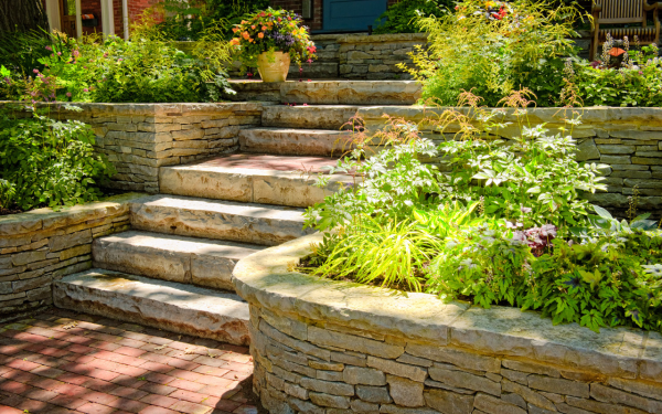 rataining wall with many plants-professional landscaping utah