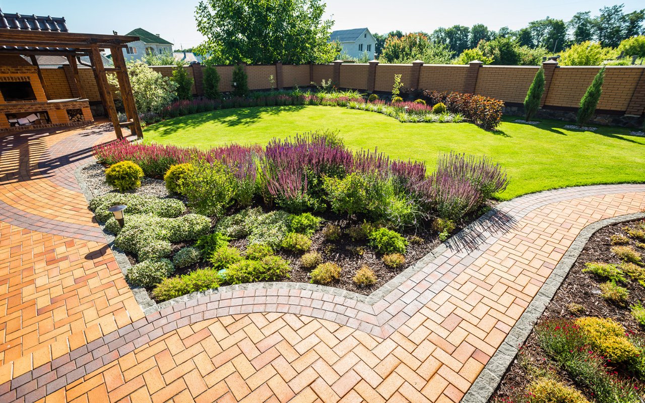 pavers and plants on a yard with a beautiful terrazze - professional landscaping Utah