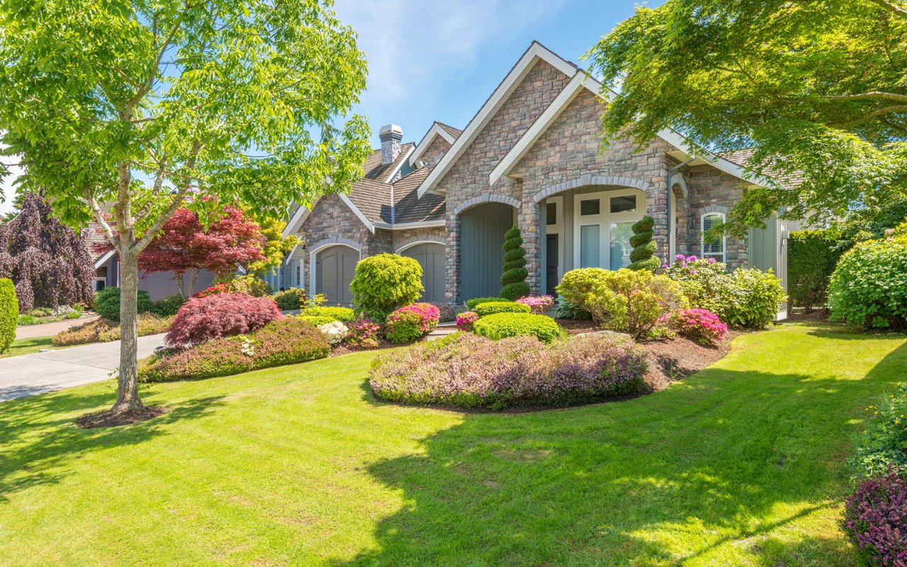 house with beautiful landscaping with trees and bushes - Professional Landscaping Utah