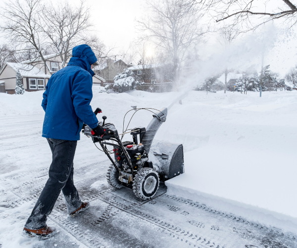 snow removal with machine -professional landscaping services